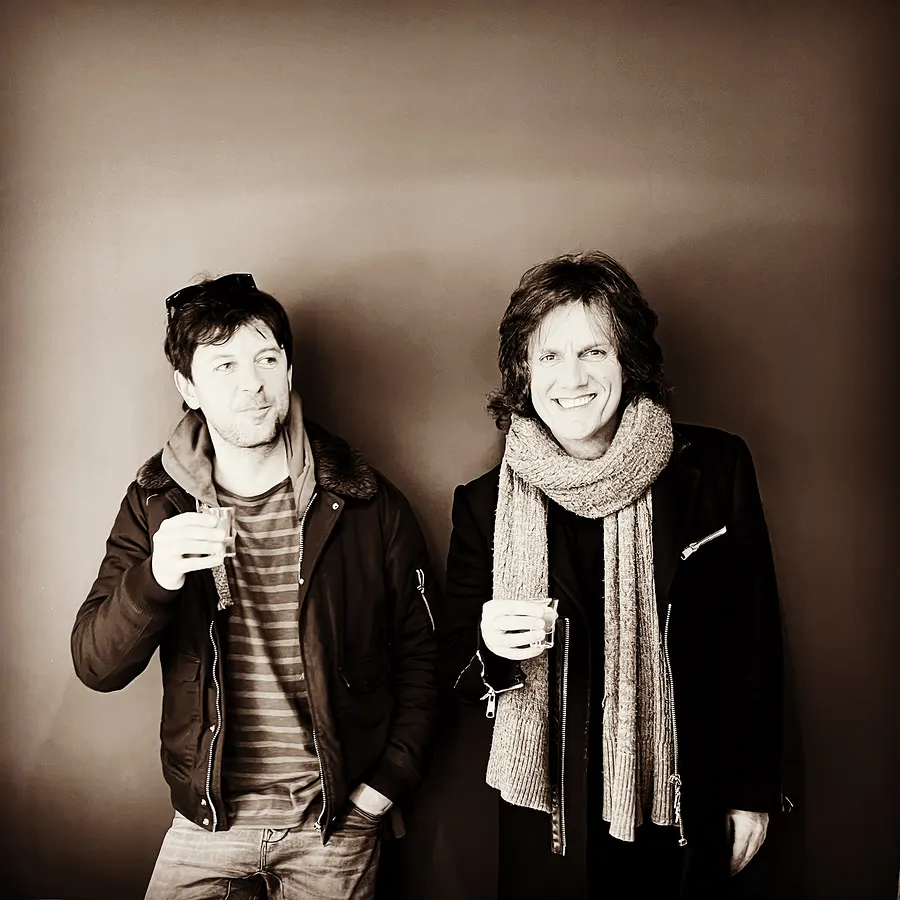 Two men with scarves, sepia portrait